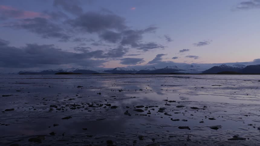 Large body of water at sunset