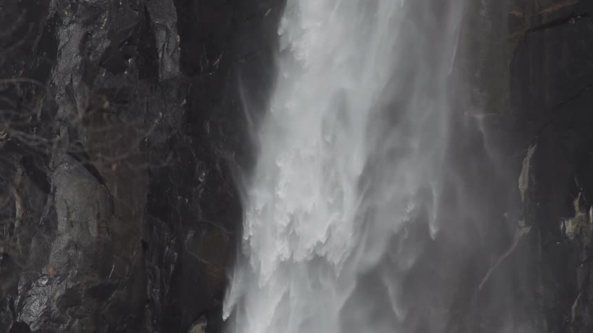 View from above of water flowing down a waterfall