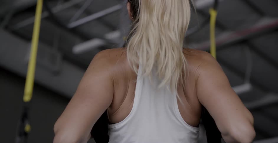 A woman exercises in a gym