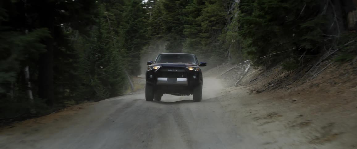 Jeep traveling over a dirt mountain road