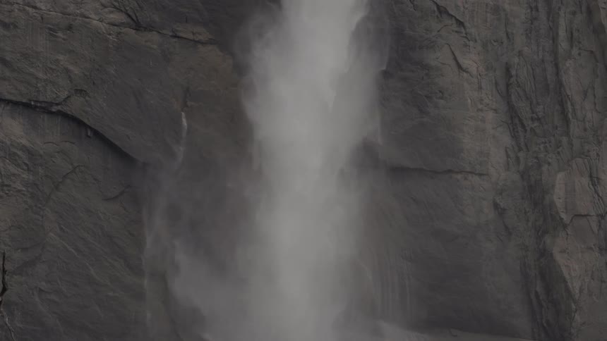Water falls over a mountain