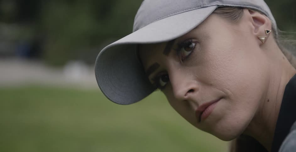 A woman golfs on a golf course