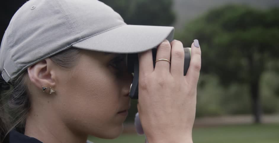 A woman looks through binoculars