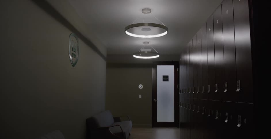Lockers stand in an empty hallway