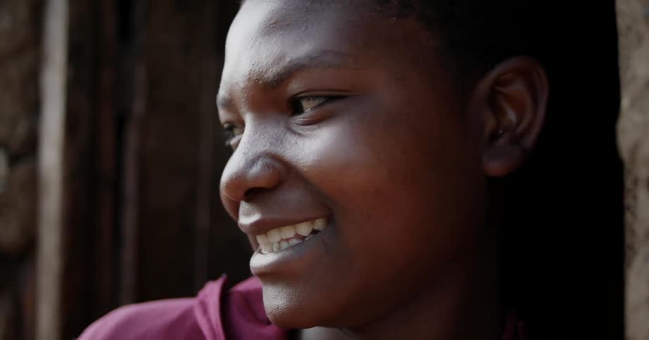 A boy smiles and laughs