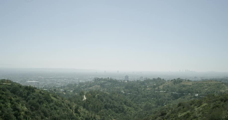 The hills ahead are covered with fog