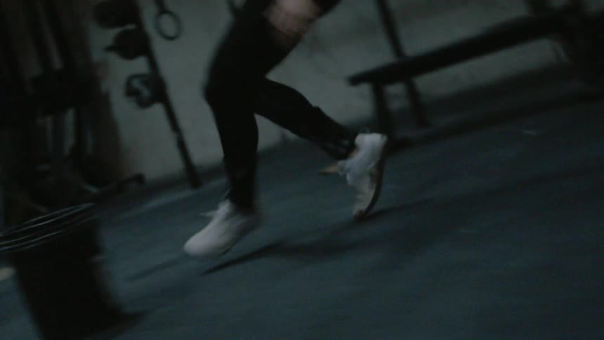 Someone is running laps in a gym