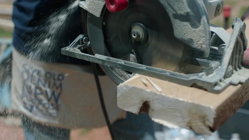 A table saw cuts through lumber