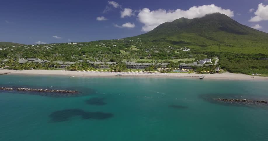 A clear blue ocean with a beach resort
