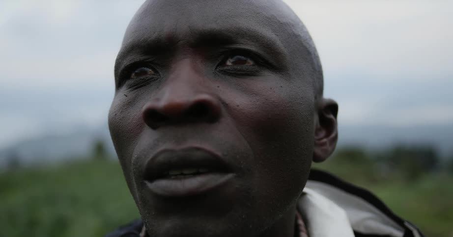A man looks worried while standing outside