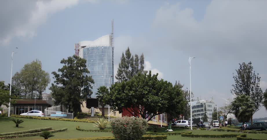 A busy city street with tall buildings in the background