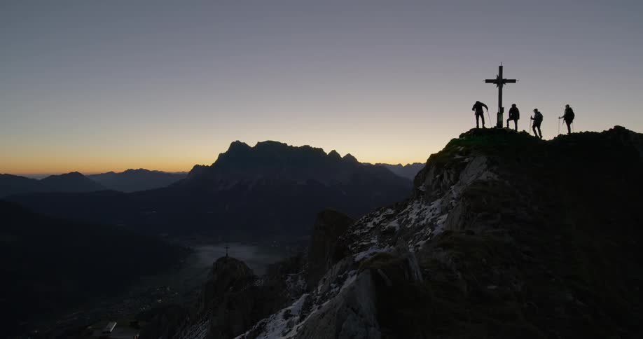 The sun is setting behind the mountain