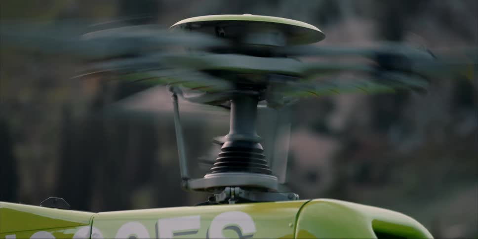 The rotors on a helicopter are spinning before take-off