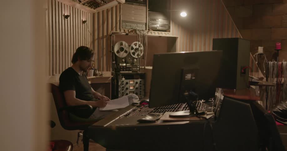A man works in a recording studio