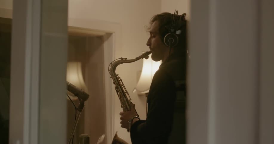 A man plays the saxophone