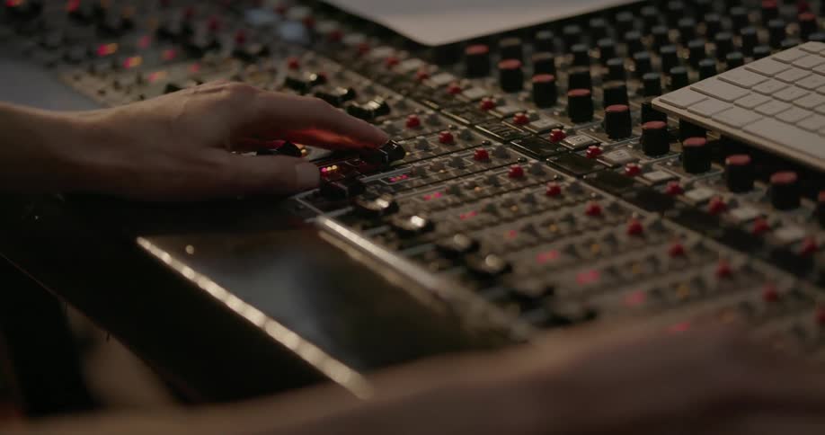 Someone is mixing music in a studio