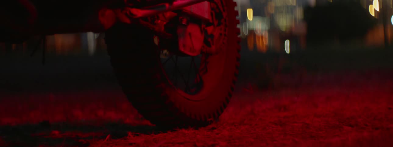 Tire illuminated by red light outside at night