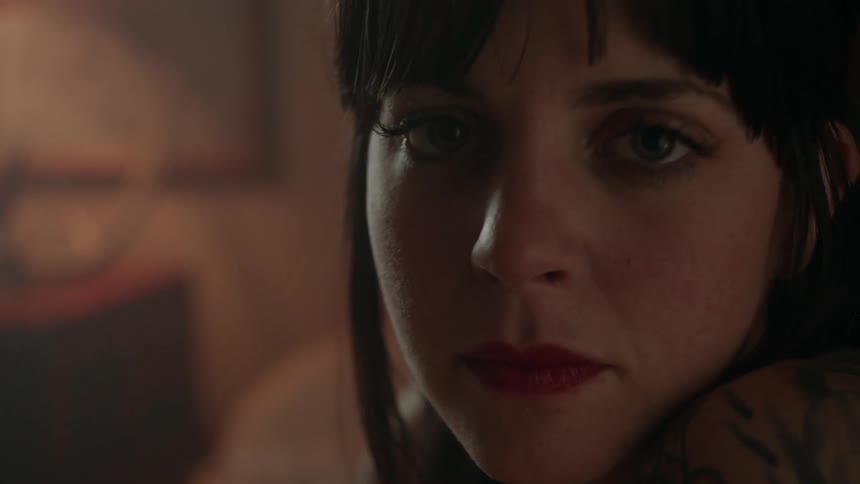 A woman closes and opens her eyes