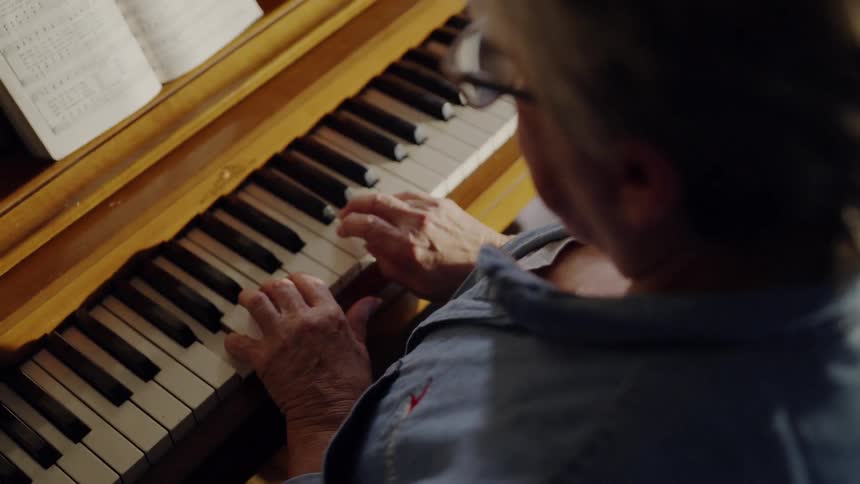 A woman is playing the piano