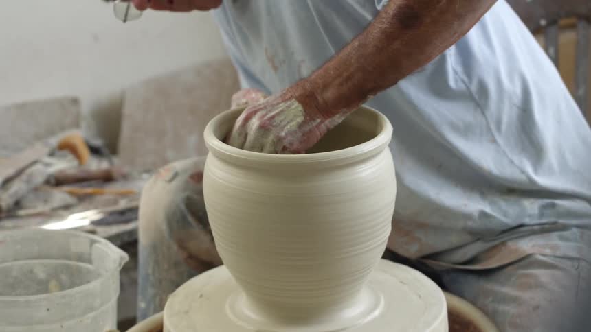 Man making a clay pot