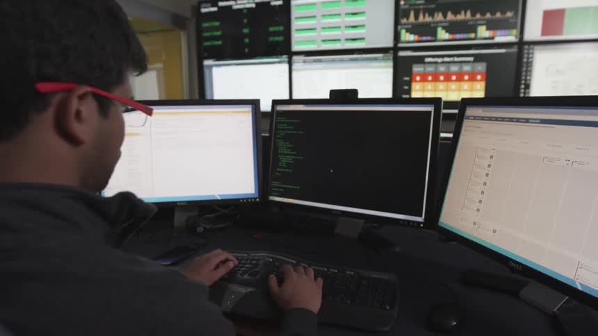 A person using multiple screens