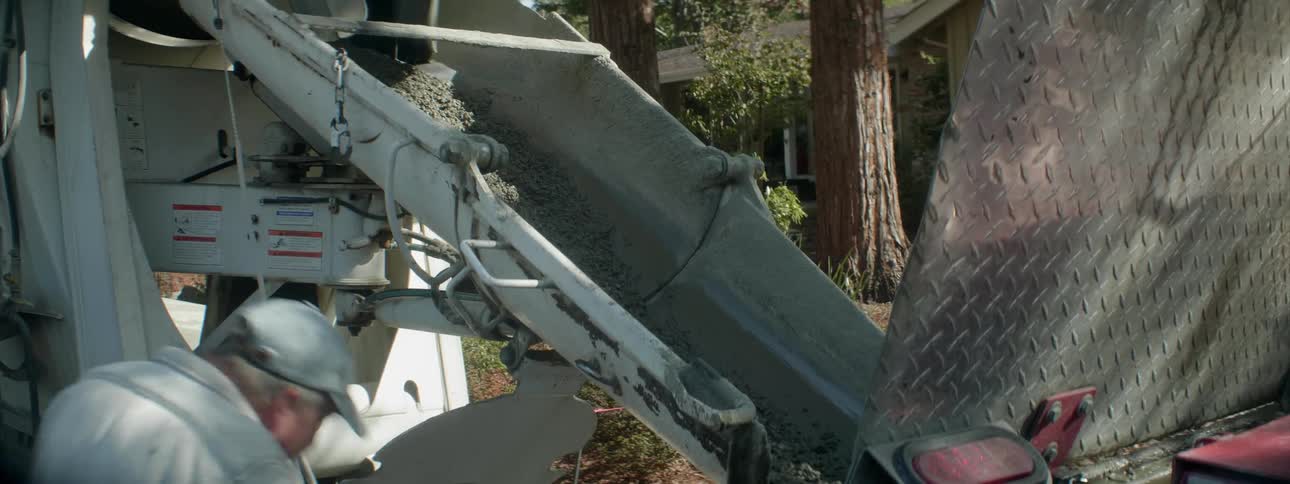 Cement is being poured from a cement truck