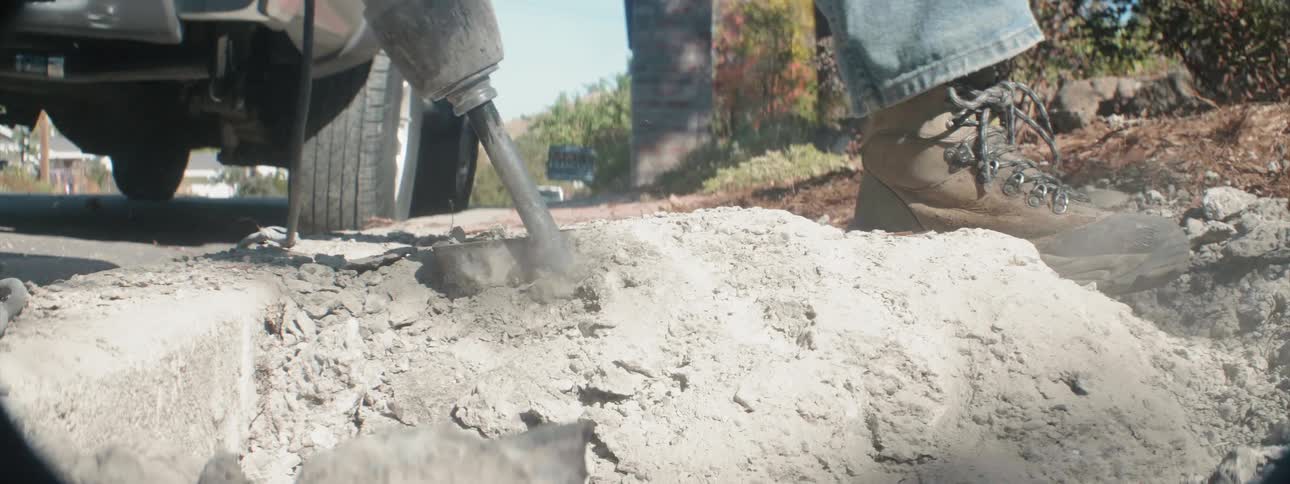 The jackhammer breaks up the concrete quickly
