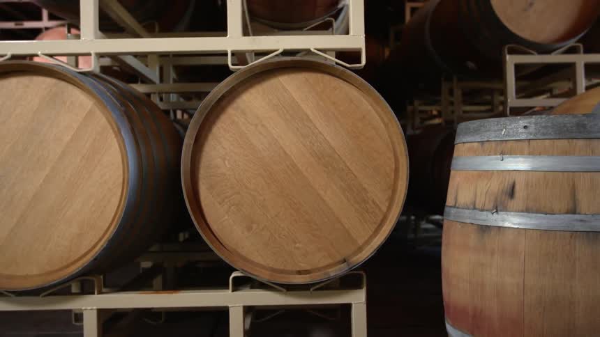 Barrels stacked on a rack with one in front