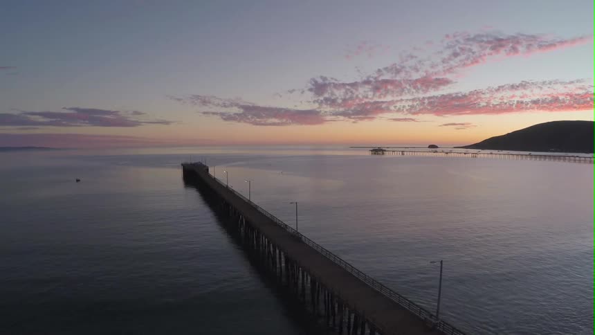 Long dock stretching over a large body of water