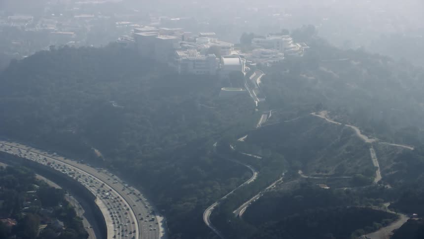 Cars drive on a city highway