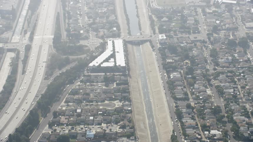 Large freeways running through a city on a hazy day
