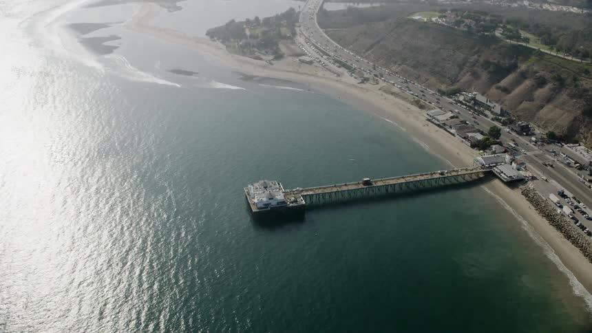 A pier extends into the ocean