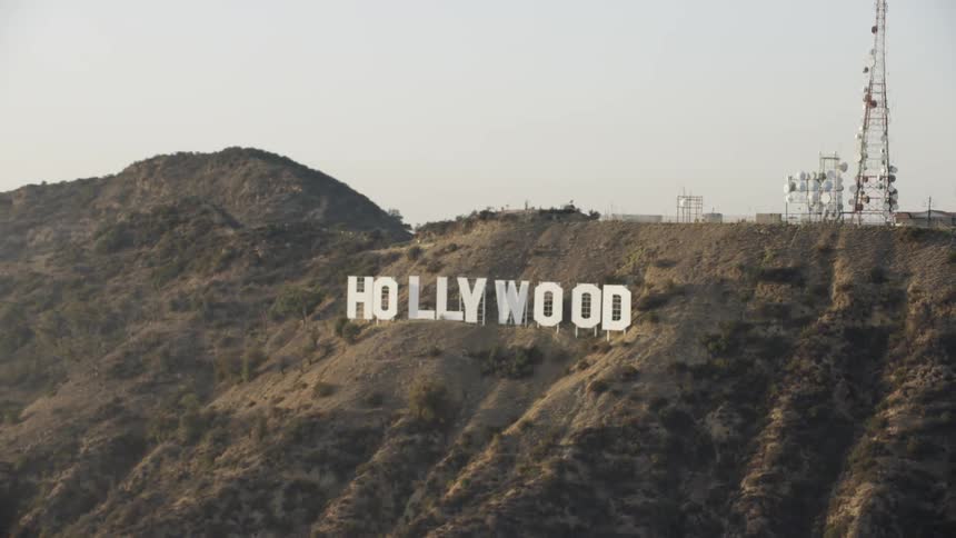 The hollywood sign sits on a hill