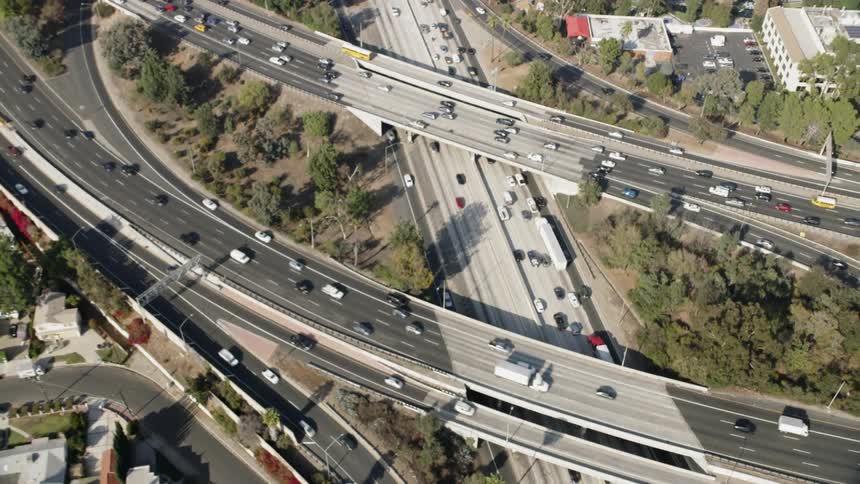 Cars travel over the interstate below on different levels