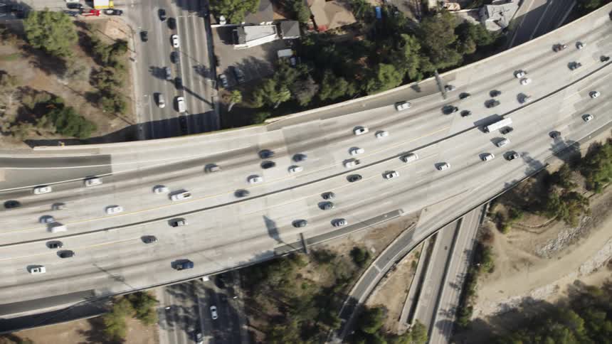 Cars drive on a city highway