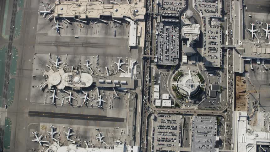 The airport below has many parked airplanes