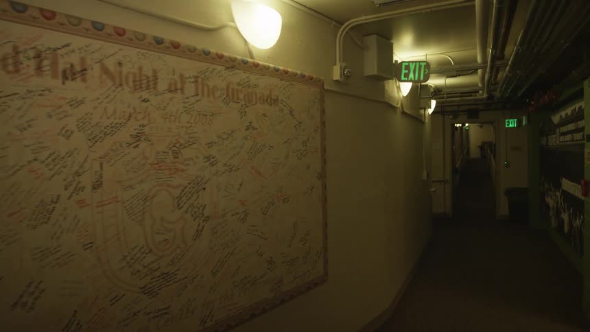 Dark hall with small lights on the wall