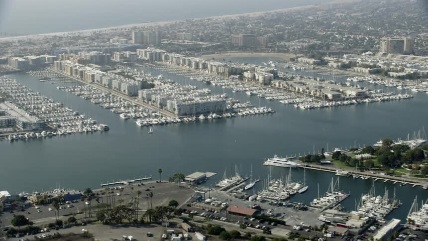 Boats float in a city marina