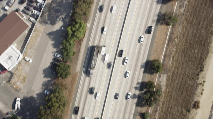Cars drive on a city highway