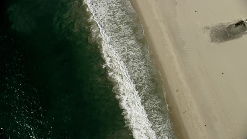Waves come to shore on the beach