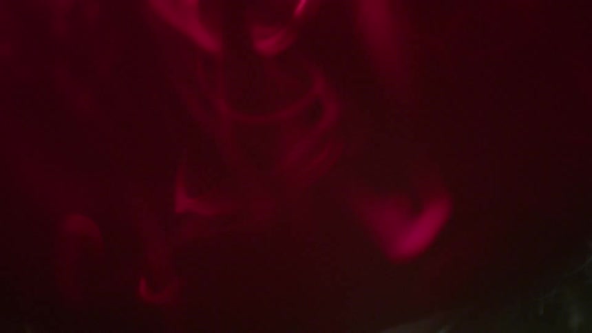 Red smoke billows in the air