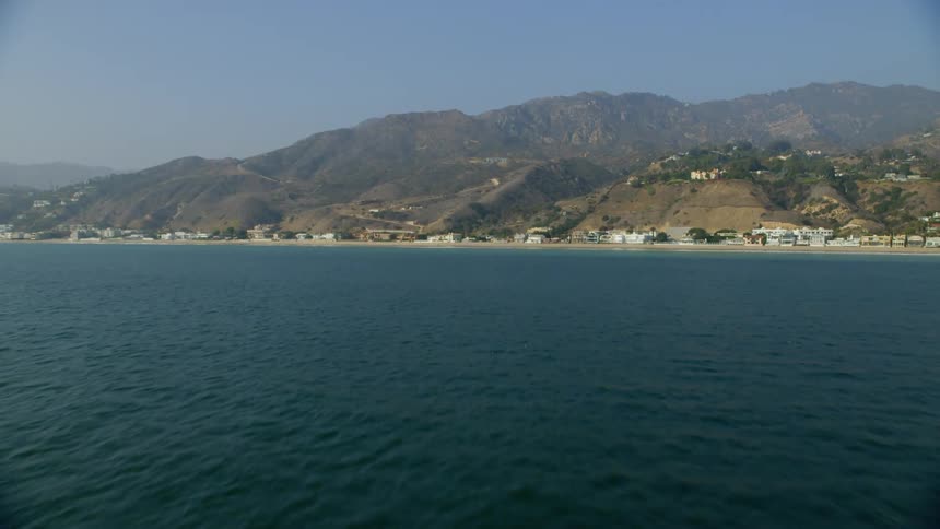 Houses line an ocean shoreline