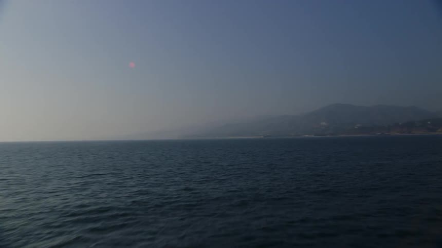 The large body of water leads to an island ahead