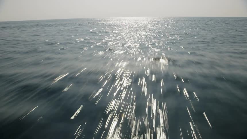Speeding above the surface of the ocean on a sunny day