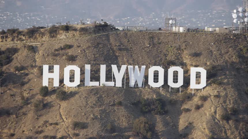 The hollywood sign is nestled in the hills