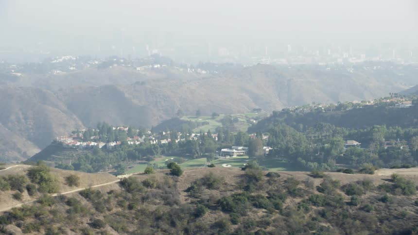 City buildings sit on hillsides