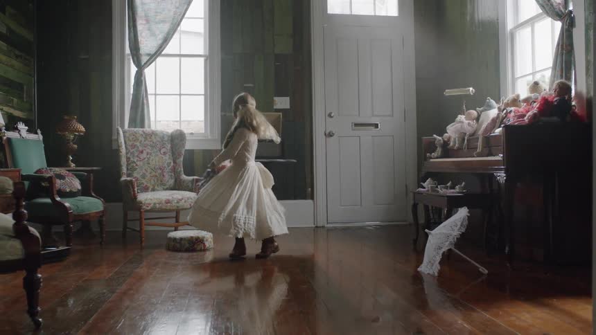A girl is in a costume dancing at home
