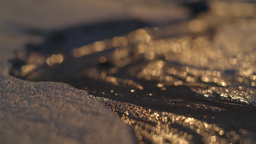 Sunlight shimmers on flowing water