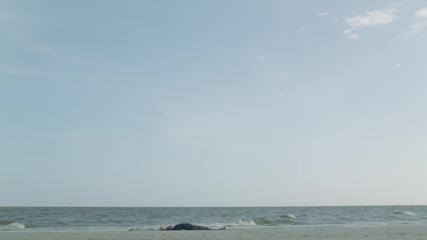 Ocean waves wash ashore on a clear day