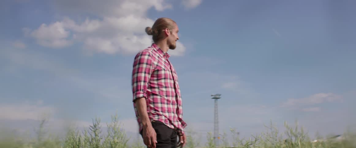 A male adventurer enjoys the fresh air and wind on his face.